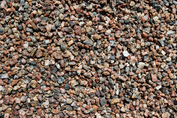 Pebbles. Wet granite multicolor pebbles stones background.