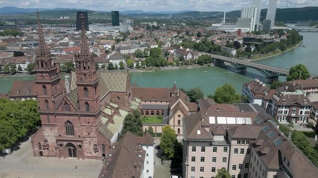 4K Drone Video of Beautiful Church on the banks of the Rhine River in Downtown Basel, Switzerland (Pan Right)