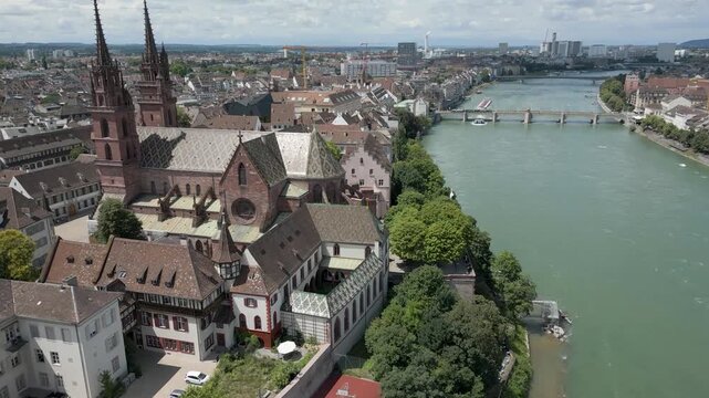 4K Drone Video of Ancient Church on the banks of the Rhine River in Downtown Basel, Switzerland (Dolly Forward)