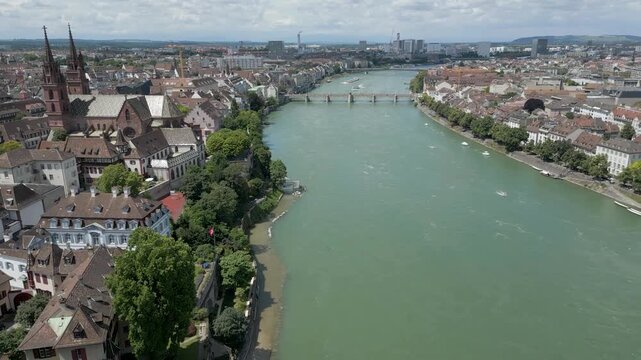 4K Drone Video of Wettsteinbr&uuml;cke and Mittlere Br&uuml;cke Bridges over the Rhine River in Downtown Basel, Switzerland (Pan Right)