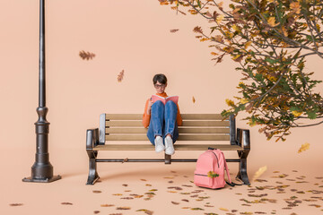Woman Reading on Park Bench with Lamp Post and Autumn Tree on Peach Background