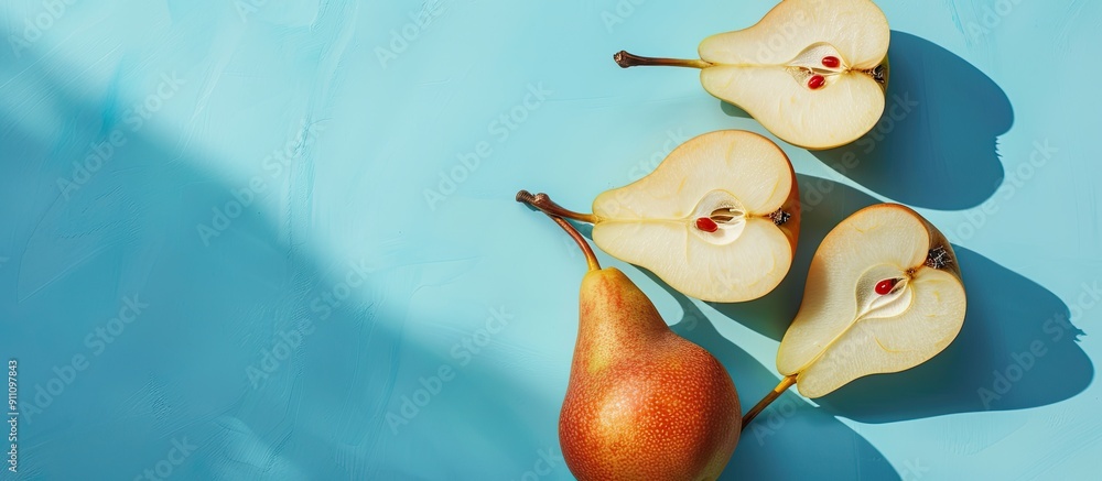Poster minimal style creative layout featuring raw sliced pears on a blue backdrop with a shadow embodying 