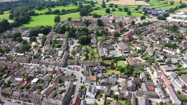 Aerial footage of the beautiful town of Masham, Ripon in North Yorkshire in the UK showing the British countryside town from above in the summer time