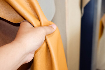 Leather material held by hand