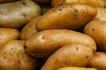 Lots of freshly harvested potatoes in the market.