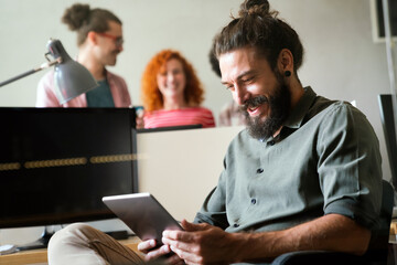 Group of business people and software developers working as a team in office