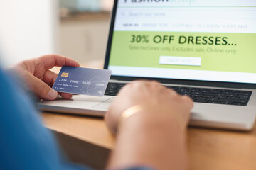 Person Shopping Online With a Credit Card at Home During Sale Event