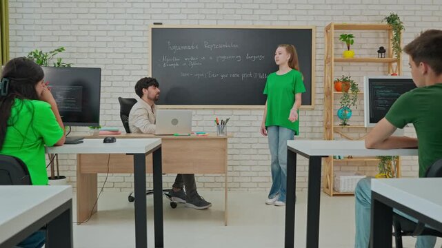 Student and Instructor Discuss Python Code in Modern Classroom