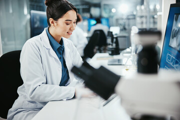 Biotechnology, woman and medical scientist in laboratory with online research for cancer clinical...