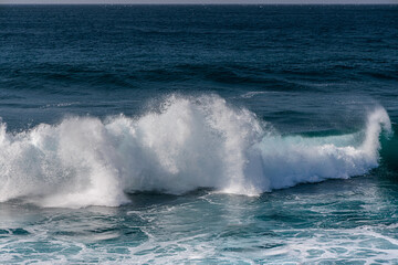 Surf waves of the ocean off the coast of the island of Lanzarote, Canary Islands