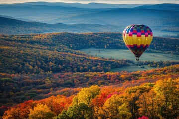 Naklejka premium Hot air balloon drifting through a colorful fall foliage landscape