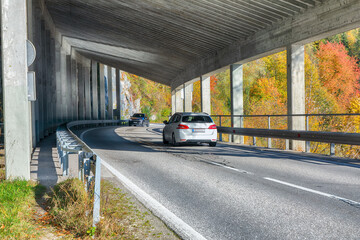 Stunning view of road and tunnel near famous Hallstatt mountain village.