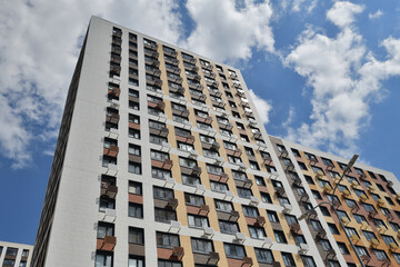 Modern new residential building with air conditioner baskets on facades, Russia