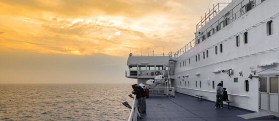 Panorama of the sunset over a cruiseship between IJmuiden and Newcastle on the North Sea