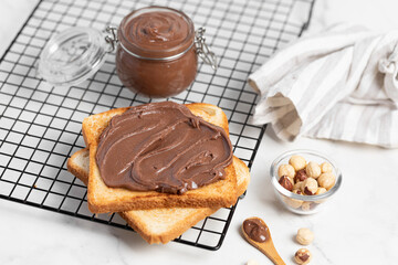 fresh toasts with chocolate paste  serve on marble table for delicious breakfast