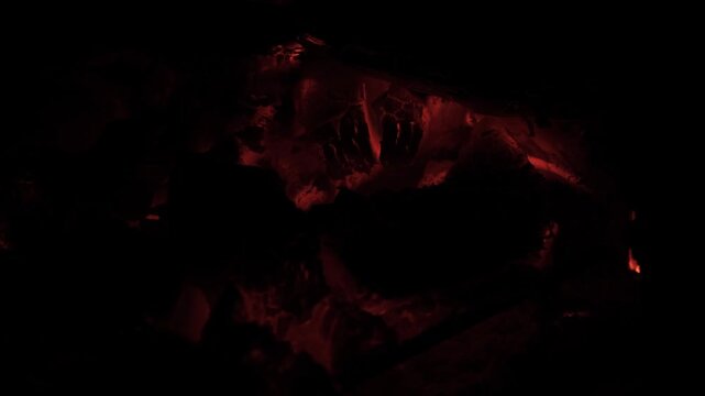 orange glowing coals smoldering in a barbecue grill for motion graphics and effects