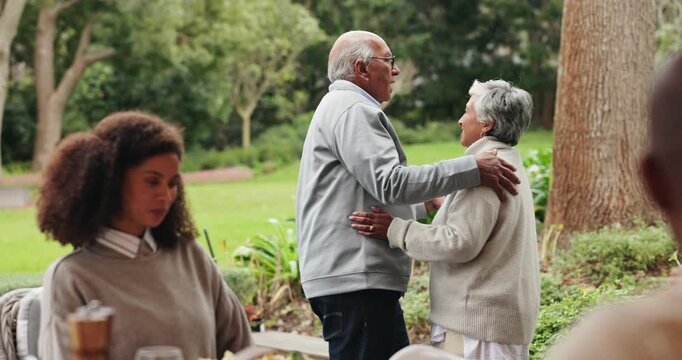 Senior, couple and dance in garden at family reunion for celebration together with fun. Happy woman, outdoor and smile with holding hands, care and love in backyard at anniversary party and event