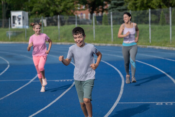 girl runs, runner, teenager, children's sports, runner, family engaged in sports, workout, warm-up, girl runs, woman runs, sports, treadmill, boy runs, happiness, childhood, happy family, funny boy