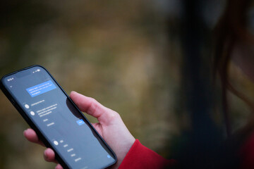 Tired fitness woman after workout and use smartphone with green screen