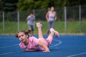 girl runs, runner falls, teenager falls, children's sports, runner, family gets involved in sports, workout, warm-up, girl runs, woman runs, sports, treadmill