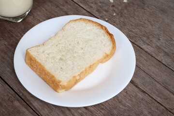Breakfast of sliced bread and milk