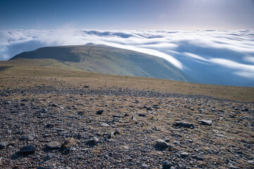 Overlooking a cloud inversion from the summit of Helvellyn in the Lake District National Park