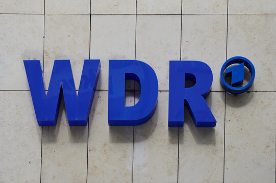 Cologne, Germany - August 05, 2024: WDR logo on building facade, WDR is a radio and broadcast station in Cologne, Germany.