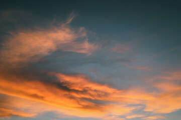 Orange cloud formations abstract nature background. Sky at sunset, orange cirrus clouds. Dramatic...