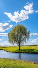 A tranquil lake reflects the vibrant green landscape and blue sky, with birds soaring above, creating a peaceful morning atmosphere in nature