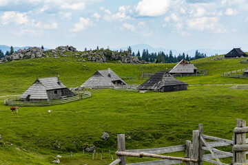 Velika Planina, Kamnik, Slovenia. Lord of the Rings style village. Wooden typical houses, hills,...