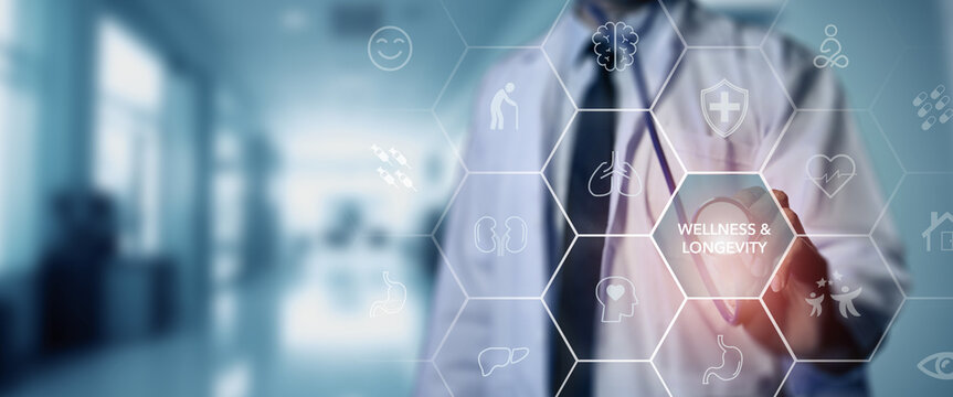 Wellness and Longevity Concept. A medical professional interacts with a digital interface displaying wellness and longevity icons, promoting health and long-term well-being.