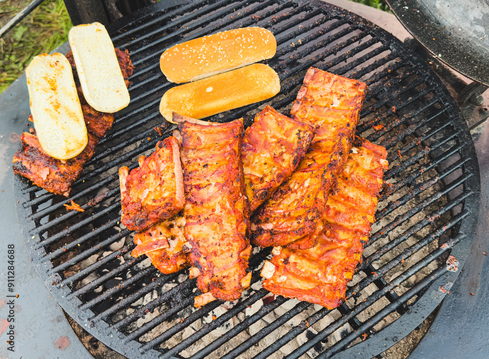 Poster Barbecue meat is fried on a metal grate