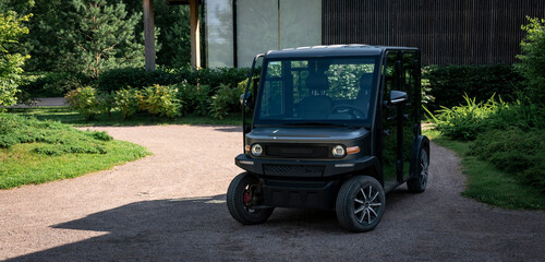 A service golf car awaits its clients at the residence