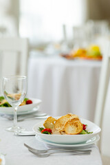 Wedding banquet in restaurant, covered round table for guests