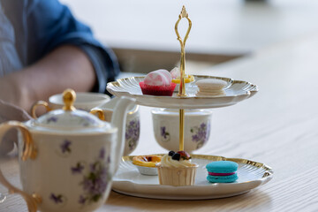 Afternoon tea is a delightful British tradition typically enjoyed between 3:30 and 5:00 PM. It consists of a light meal with a variety of finger foods, served alongside freshly brewed tea. The classic