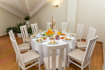 Wedding banquet in restaurant, covered round table for guests