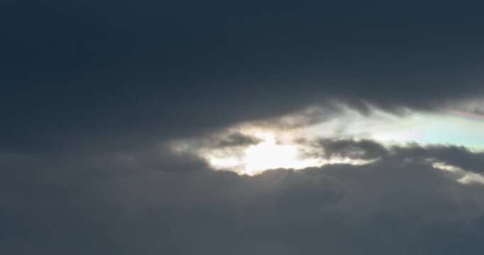 4K Time-lapse video of rain clouds moving in to block out the sun during the rainy season in Thailand. Light and Dark.