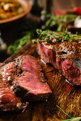 Close-up overhead view of grilled top blade beef steak cut on slices