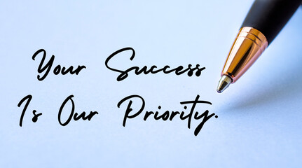 Your success is our priority text with close up pen background. Customer centric concept.