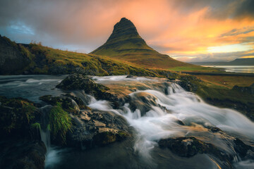 Long exposure shot of the Kirkjufell mountain with the river in the foreground, in Iceland, sunrsie
