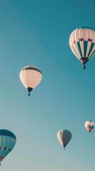 Naklejka premium several hot air balloons floating in the clear blue sky