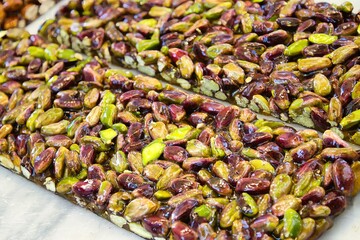 Close-up of sweet pistachio nut bars with honey