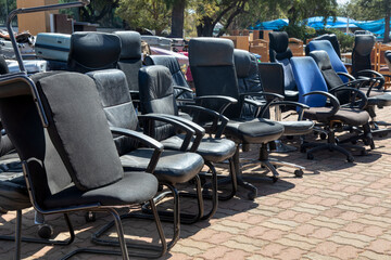 auction old office furniture sale, yard sale, chairs, desks, lots of broken office chairs going for...