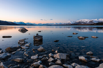 Fototapeta premium Serene sunset view at Lake Tekapo, New Zealand.