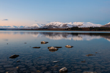 Beautiful snowy mountain view at Lake Tekapo, New Zealand.
