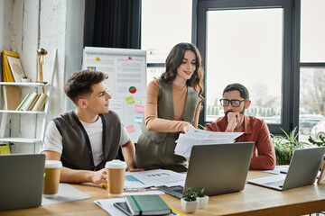 Colleagues engage in a serious discussion in an open workspace.