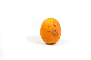 wrinkled orange, stored in the refrigerator, isolated on white background