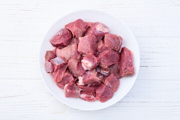 Beef cubes . Photography of raw cutting meat