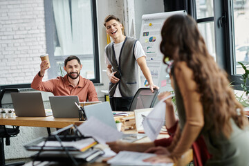 Naklejka premium Team members support each other with smiles in office.