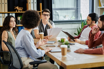 Team members collaborate during a critical work discussion.